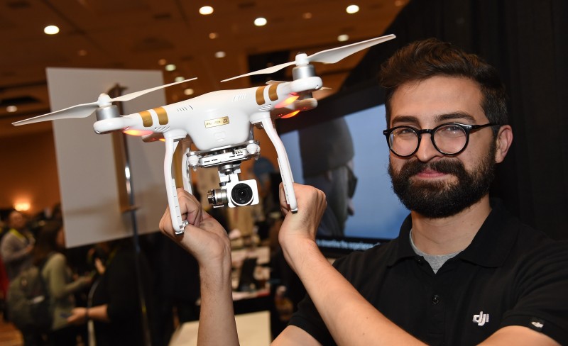 LAS VEGAS, NV - JANUARY 04: Michael Perry displays a DJI Innovations DJI Phantom 3 4K drone during a press event for CES 2016 at the Mandalay Bay Convention Center on January 4, 2016 in Las Vegas, Nevada. The unit can fly for 25 minutes and will be available at the end of January for USD 799 and features a 4K video camera that can transmit over Wi-Fi and downward facing sensors that allow the drone to stabilize without using GPS. CES, the world's largest annual consumer technology trade show, runs from January 6-9 and is expected to feature 3,600 exhibitors showing off their latest products and services to more than 150,000 attendees.   Ethan Miller/Getty Images/AFP  