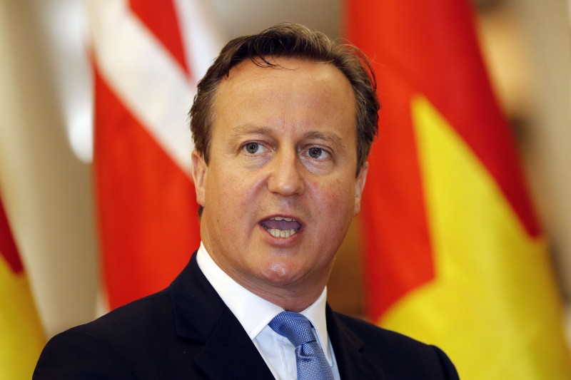  BRITAIN'S PRIME MINISTER DAVID CAMERON SPEAKS DURING A JOINT PRESS CONFERENCE WITH HIS VIETNAMESE COUNTERPART NGUYEN TAN DUNG IN HANOI ON JULY 29, 2015. CAMERON HAILED RAPIDLY GROWING TRADE WITH VIETNAM DURING THE FIRST VISIT BY A BRITISH PRIME MINISTER TO THE COMMUNIST COUNTRY, AS A NUMBER OF KEY BUSINESS DEALS WERE SIGNED. AFP PHOTO /  POOL / LUONG THAI LINH  