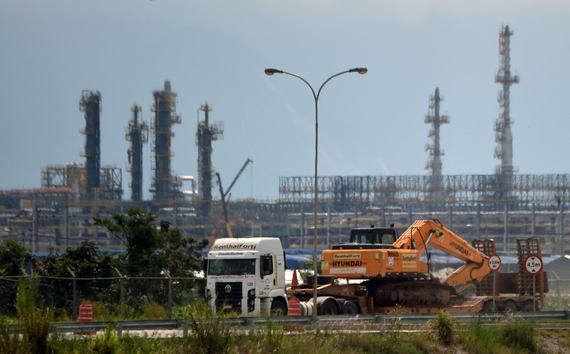  TO GO WITH AFP STORY  A TRUCK CARRIES CONSTRUCTION MACHINERY NEAR THE REFINERY AND PROCESSING PLANT 