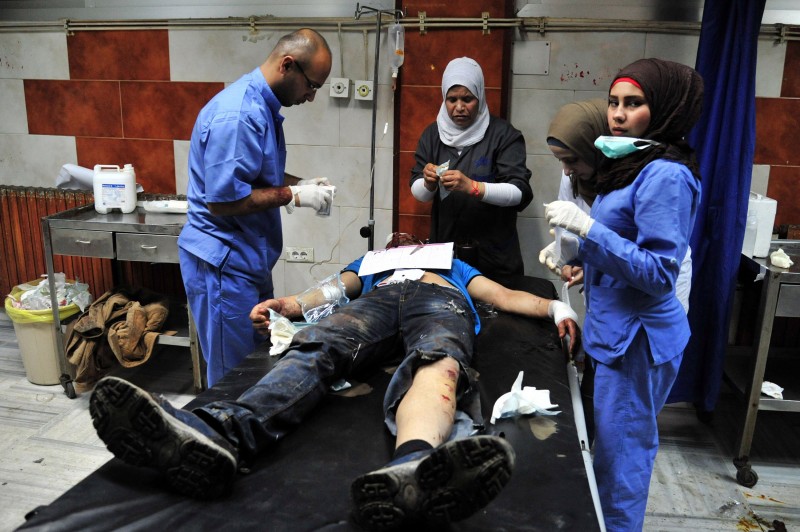  A HANDOUT PICTURE RELEASED BY THE OFFICIAL SYRIAN ARAB NEWS AGENCY (SANA) ON FEBRUARY 21, 2016 SHOWS A WOUNDED SYRIAN RECEIVING TREATMENT AT A HOSPITAL IN THE SYRIAN CAPITAL DAMASCUS.  AT LEAST 30 PEOPLE WERE KILLED IN A SERIES OF ATTACKS, INCLUDING A CAR BOMBING, NEAR A SHIITE SHRINE SOUTH OF SYRIA'S CAPITAL, STATE TELEVISION AND THE SYRIAN OBSERVATORY FOR HUMAN RIGHTS SAID.  / AFP / SANA / - /  == RESTRICTED TO EDITORIAL USE - MANDATORY CREDIT "AFP PHOTO / HO / SANA" - NO MARKETING NO ADVERTISING CAMPAIGNS - DISTRIBUTED AS A SERVICE TO CLIENTS ==  