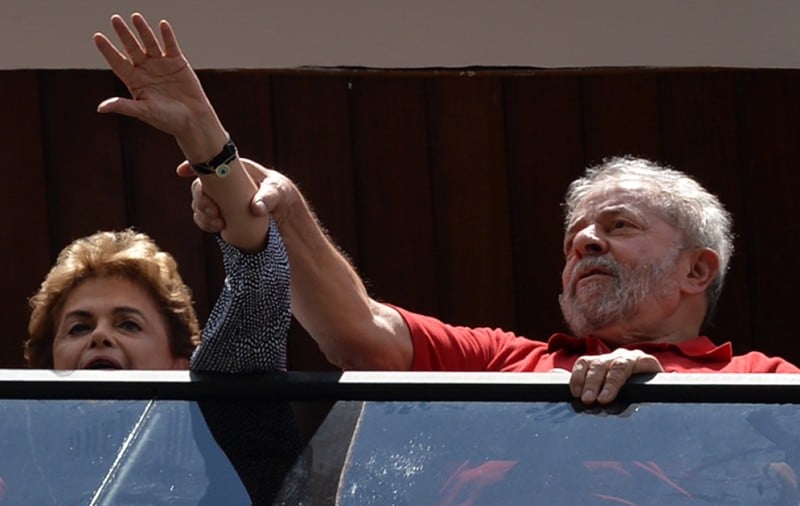  FORMER BRAZILIAN PRESIDENT LUIZ INACIO LULA DA SILVA (R) AND CURRENT PRESIDENT DILMA ROUSSEFF GREET SUPPORTERS GATHERING OUTSIDE HIS HOUSE TO SHOW HIM THEIR SUPPORT, IN SAO BERNARDO DO CAMPO, NEAR SAO PAULO, BRAZIL, ON MARCH 5, 2016. BRAZIL'S EX-PRESIDENT LULA DA SILVA VOWED TO BATTLE HIS OPPONENTS IN THE STREETS IN A DEFIANT SPEECH LATE FRIDAY, HOURS AFTER BEING BRIEFLY DETAINED AS PART OF A PROBE INTO A MASSIVE CORRUPTION SCHEME. PROSECUTORS SAID LULA WAS TARGETED AS PART OF THE OPERATION CAR WASH INVESTIGATION INTO A SPRAWLING EMBEZZLEMENT AND BRIBERY CONSPIRACY CENTRED ON THE STATE OIL GIANT PETROBRAS. LULA WAS NOT ARRESTED, BUT HELD FOR QUESTIONING OVER ALLEGED "FAVORS" RECEIVED FROM C  