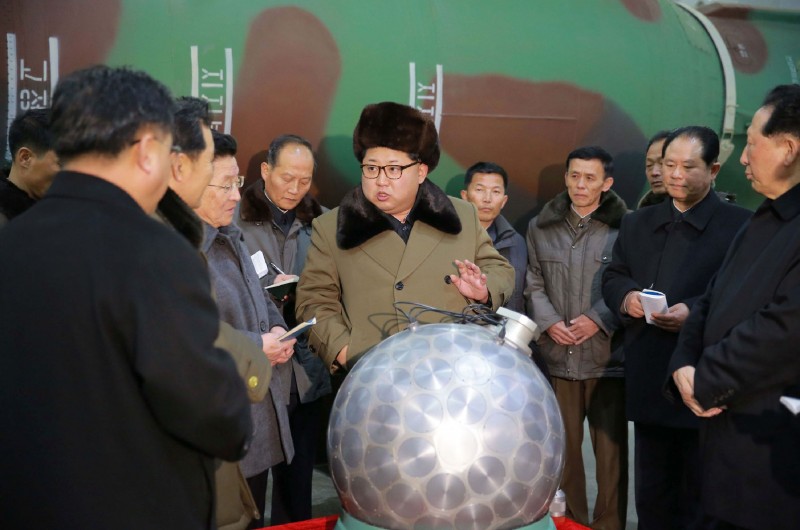  This undated picture released from North Korea's official Korean Central News Agency (KCNA) on March 9, 2016 shows North Korean leader Kim Jong-Un (C) meeting with the scientists and technicians in the field of researches into nuclear weapons and guiding the work for boosting the  nuclear arsenal at an undisclosed location.  