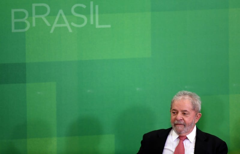  Former Brazilian president Luiz Inacio Lula da Silva applauds after he swore as chief of staff, in Brasilia on March 17, 2016. Rousseff appointed Lula da Silva as her chief of staff hoping that his political prowess can save her administration. The president is battling an impeachment attempt, a deep recession, and the fallout of an explosive corruption scandal at state oil giant Petrobras. AFP PHOTO/EVARISTO SA  