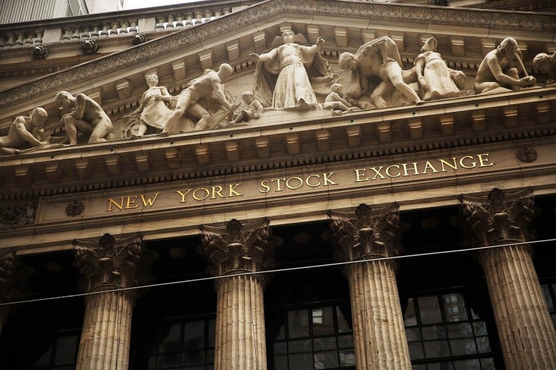  NEW YORK, NY - DECEMBER 21: The New York Stock Exchange (NYSE) stands on Wall Street and Exchange Streets on December 21, 2015 in New York City. The Dow Jones industrial average was up over 100 points in morning trading following Friday's huge drop as the price of oil continued its yearly fall.   Spencer Platt/Getty Images/AFP  == FOR NEWSPAPERS, INTERNET, TELCOS &TELEVISION USE ONLY ==  