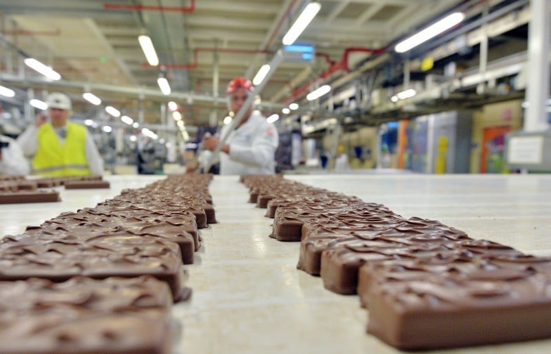  (FILES) This file photo taken on June 19, 2014 shows employees of the American Mars group working on Mars chocolate bars on June 19, 2014, in the Mars' factory of Haguenau, eastern France, as the company celebrates the 40th anniversary of Mars Chocolate France and inaugurates the extension of the factory.   Confectioner Mars said on February 23, 2016 Tuesday it was withdrawing its Mars and Snickers chocolate bars and Celebrations sweets from sale in several European countries. In addition to France, Mars said it was recalling the items from Britain, Belgium, Italy and Spain, after it had already withdrawn products from sale in Germany and Netherlands. The recall was made after a piece of pla  