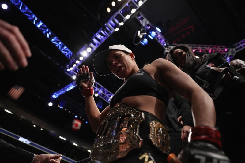 LAS VEGAS, NV - DECEMBER 30: Amanda Nunes of Brazil exits the Octagon after her victory over Ronda Rousey in their UFC women's bantamweight championship bout during the UFC 207 event on December 30, 2016 in Las Vegas, Nevada.   Christian Petersen/Getty Images/AFP
      Caption