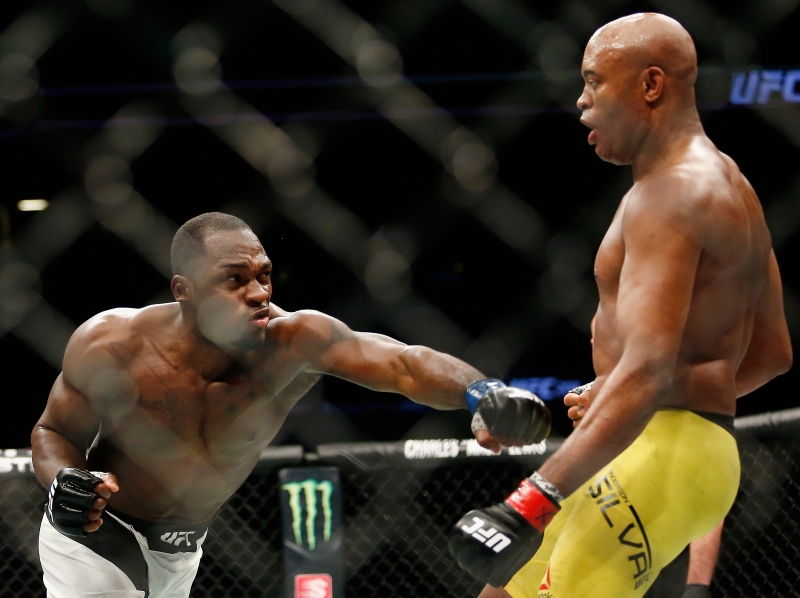 NEW YORK, NY - FEBRUARY 11: (L-R) Derek Brunson of United States throws a punch as he looks at Anderson Silva of Brazil in their middleweight bout during UFC 208 at the Barclays Center on February 11, 2017 in the Brooklyn Borough of New York City.   Anthony Geathers/Getty Images/AFP
      Caption