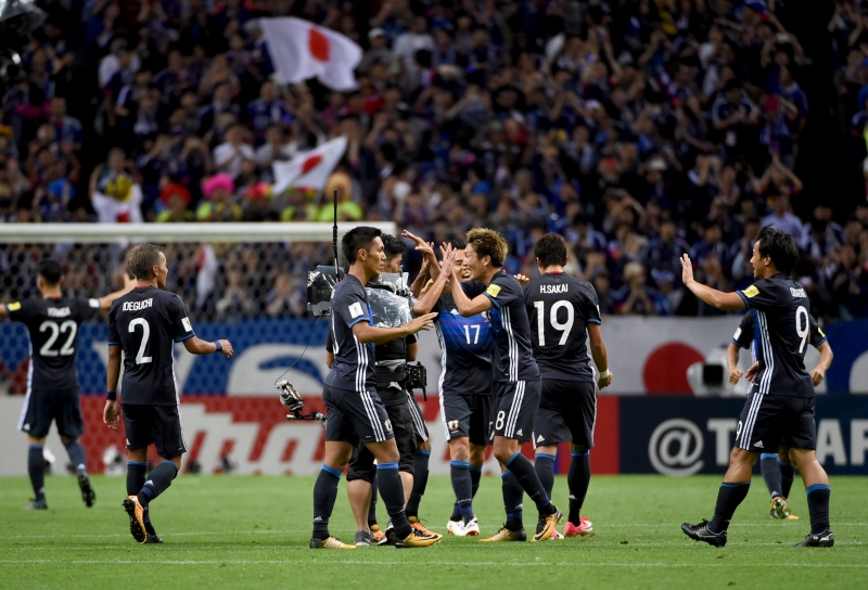 Comemoração no final da partida: Japão garantiu com uma rodada de antecedência a classificação