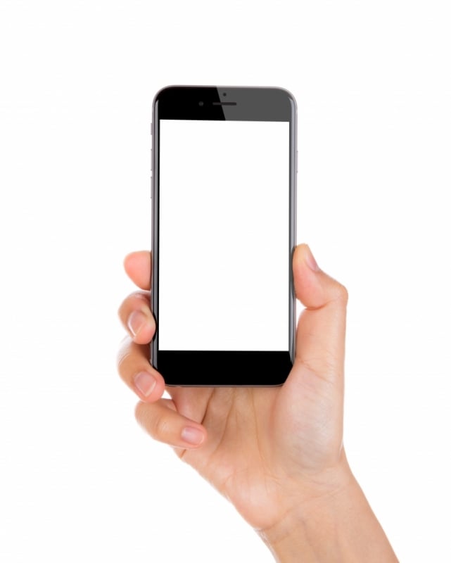 Hand holding mobile smart phone with blank screen Isolated on white background Foto: .