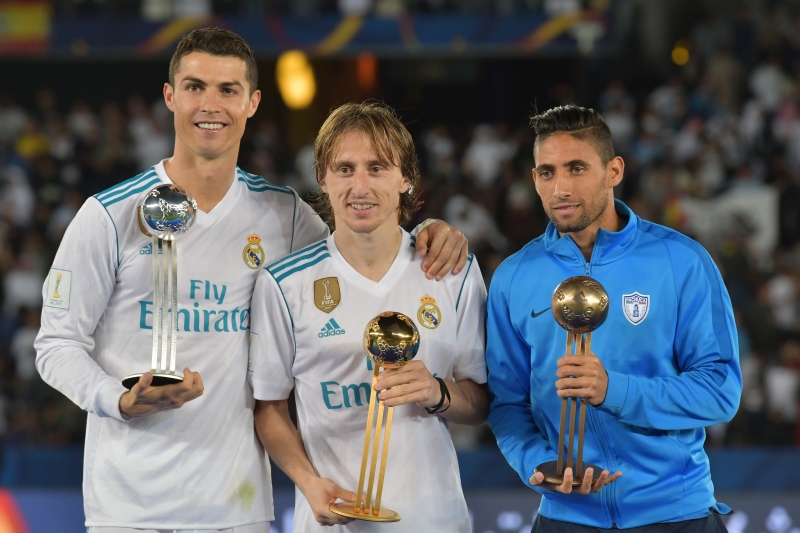 Modric (ao centro), Ronaldo (esquerda) e Urretaviscaya (direita) foram eleitos os destaques do Mundial 
