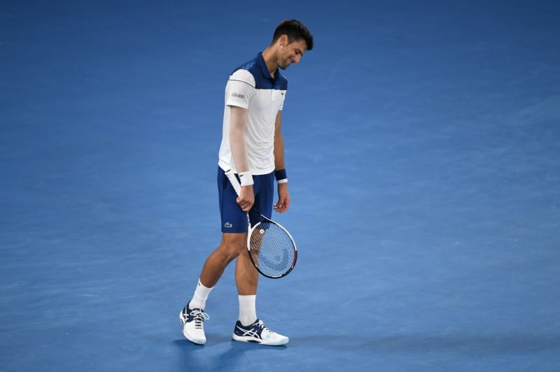 Serbia's Novak Djokovic reacts during their men's singles fourth round match against South Korea's Hyeon Chung on day eight of the Australian Open tennis tournament in Melbourne on January 22, 2018. / AFP PHOTO / WILLIAM WEST / -- IMAGE RESTRICTED TO EDITORIAL USE - STRICTLY NO COMMERCIAL USE --