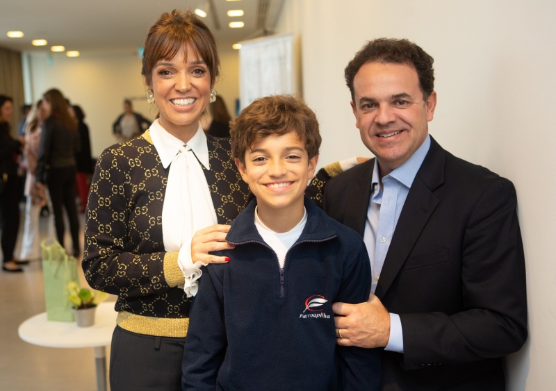 A anfitriã Patricia Hermann com Roberto e Eduardo Coelho