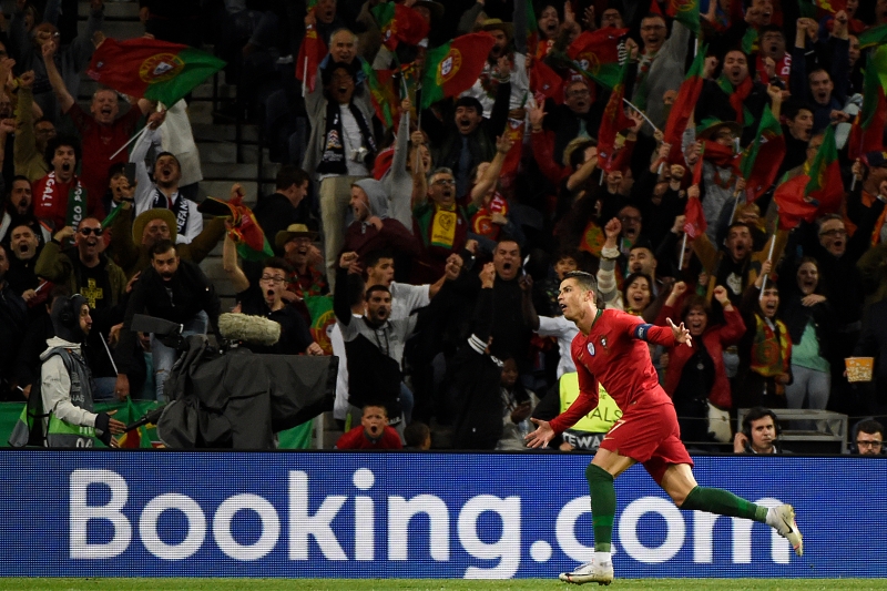 Portugal's forward Cristiano Ronaldo celebrates his third goal during the UEFA Nations League semi-final football match between Portugal and Switzerland at the Dragao stadium in Porto on June 5, 2019. (Photo by MIGUEL RIOPA / AFP)