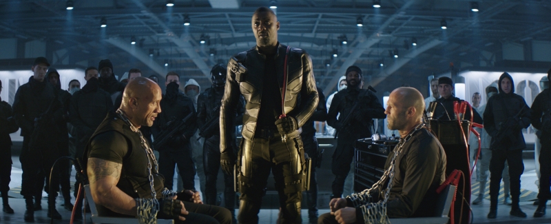 Com Idris Elba (centro), filme retorna com os personagens de Dwayne "The Rock" Johnson (esq.) e Jason Statham (dir.)