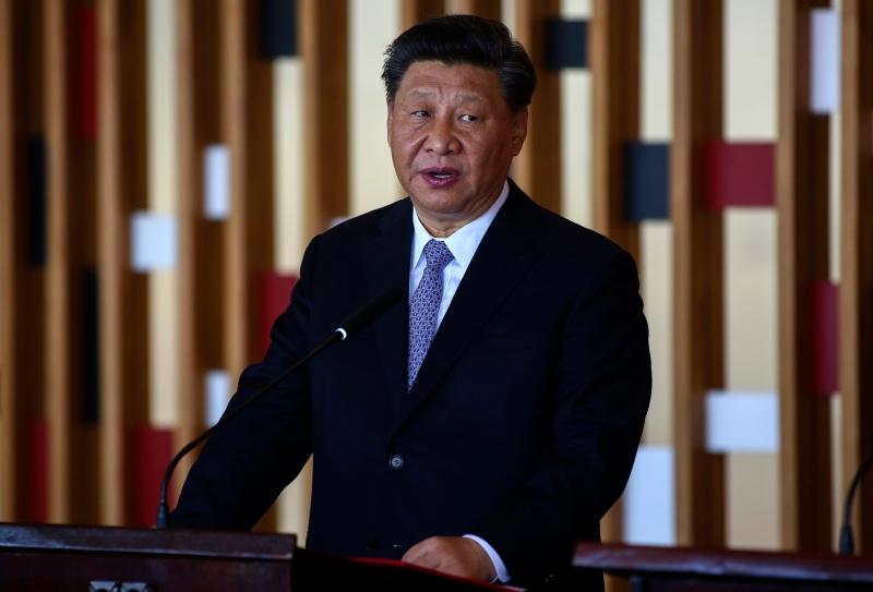Chinese President Xi Jinping speaks during a joint presser after a bilateral meeting with his Brazilian counterpart Jair Bolsonaro (out of frame) at Itamaraty Palace in Brasilia, Brazil, on November 13, 2019. - Brazil's President Jair Bolsonaro walked a diplomatic tightrope, as he seeks to boost ties with Beijing and avoid upsetting key ally Donald Trump, on the eve of a summit with their BRICS counterparts from Russia, India and South Africa. (Photo by Sergio LIMA / AFP)
      Caption