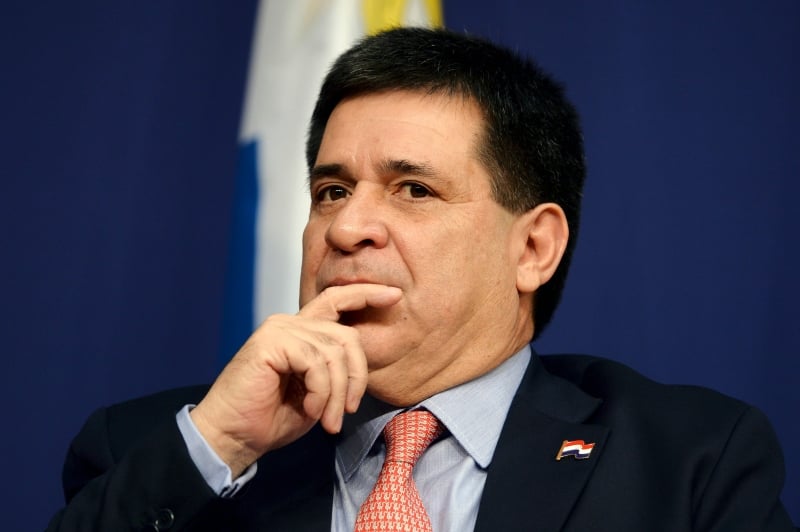 (FILES) In this file photo taken on June 03, 2016, Paraguay's President Horacio Cartes listens during the Latin America and Caribbean International economic forum at the Economy Ministry in Paris. - Brazilian justice called on November 19, 2019, for Paraguay's former President Horacio Cartes to be placed under preventive detention for alleged money laundering in conection with the Lava Jato anti-corruption probe, official sources and the state-run Agencia Brasil reported. (Photo by ERIC PIERMONT / AFP)