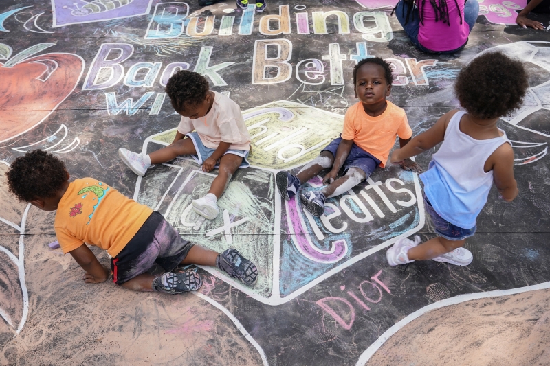 WASHINGTON, DC - JULY 14: Children from the KU Kids Deanwood Childcare Center complete a mural celebrating the launch of the Child Tax Credit on July 14, 2021 at the KU Kids Deanwood Childcare Center in Washington, DC.   Jemal Countess/Getty Images for Community Change/AFP (Photo by Jemal Countess / GETTY IMAGES NORTH AMERICA / Getty Images via AFP)