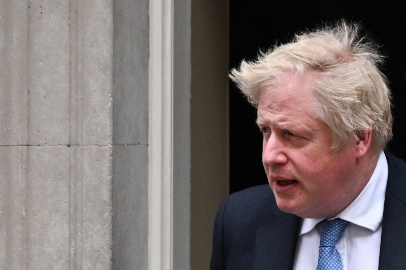 Britain's Prime Minister Boris Johnson leaves the 10 Downing Street, in London, on April 19, 2022, to give a statement at the House of Commons. (Photo by Ben Stansall / AFP)
