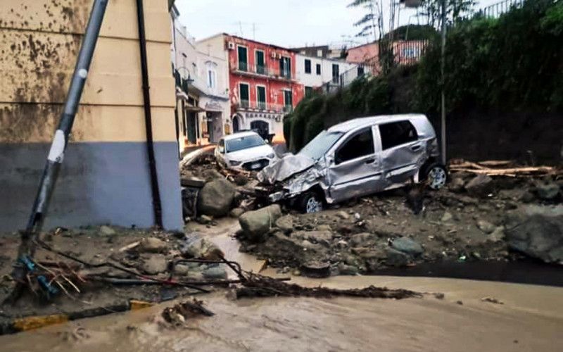  Destroyed cars are picturedin Casamicciola in the southern Ischia island on November 26, 2022, following heavy rains that sparked a landslide. - Italy's interior minister said there had been no confirmed deaths in a landslide on November 26, 2022 on the island of Ischia, despite earlier reports of eight killed. (Photo by ANSA / Ansa / AFP) / Italy OUT
      Caption
