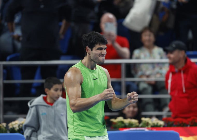  Spains Carlos Alcaraz celebrates after defeating France's Arthur Rinderknech during their mens singles match at the Qatar Open tennis tournament in Doha on February 17, 2026. (Photo by Karim JAAFAR / AFP)